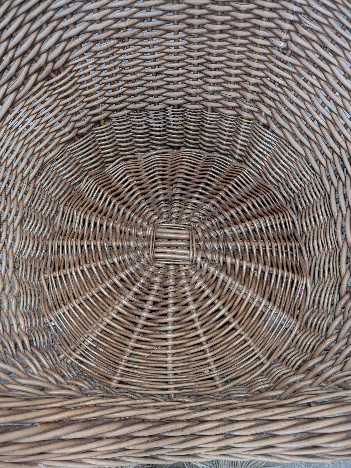 Large woven rattan armchair