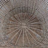 Large woven rattan armchair