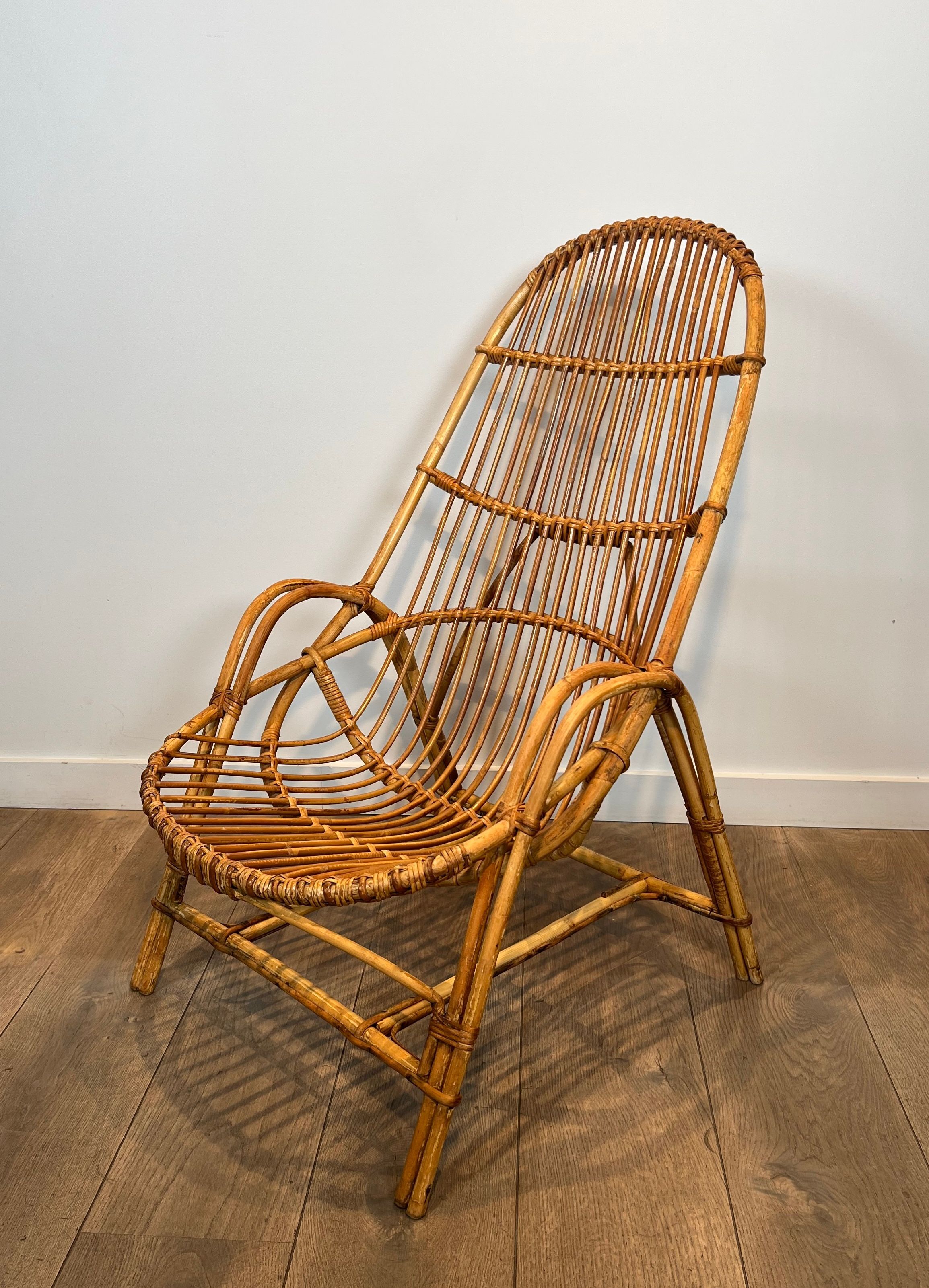 Pair of designer armchairs in rattan