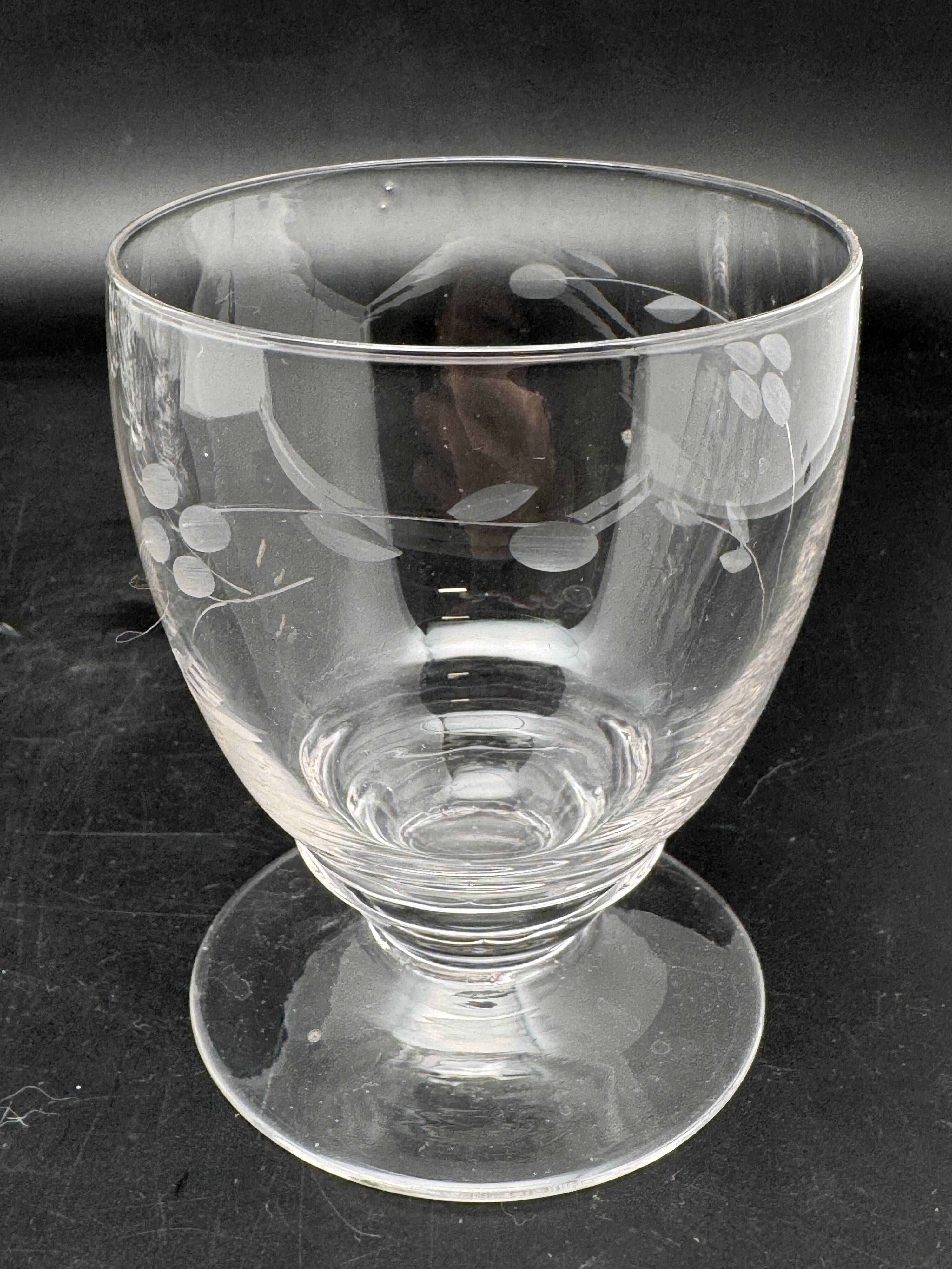 Set of fine glass stemmed glasses with small flower patterns