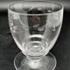 Set of fine glass stemmed glasses with small flower patterns