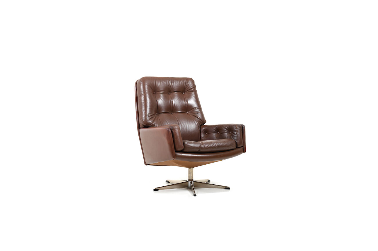 Danish swivel lounge chair in brown leather