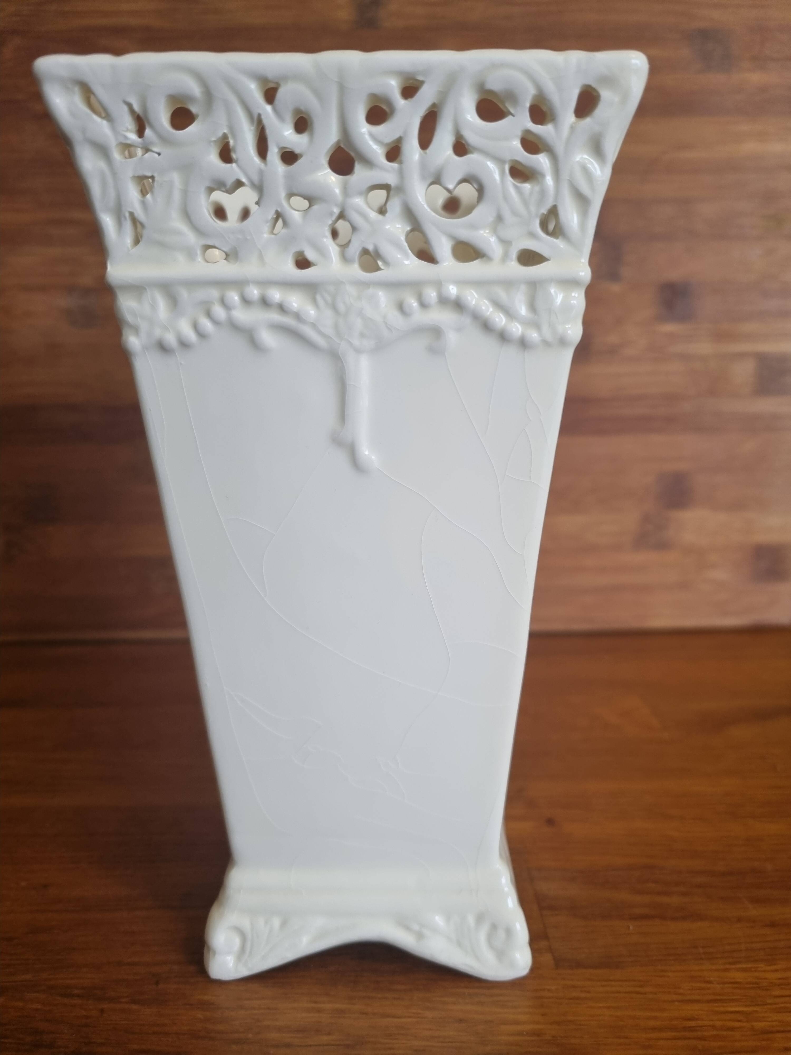 Vintage ceramic vase with lace edge