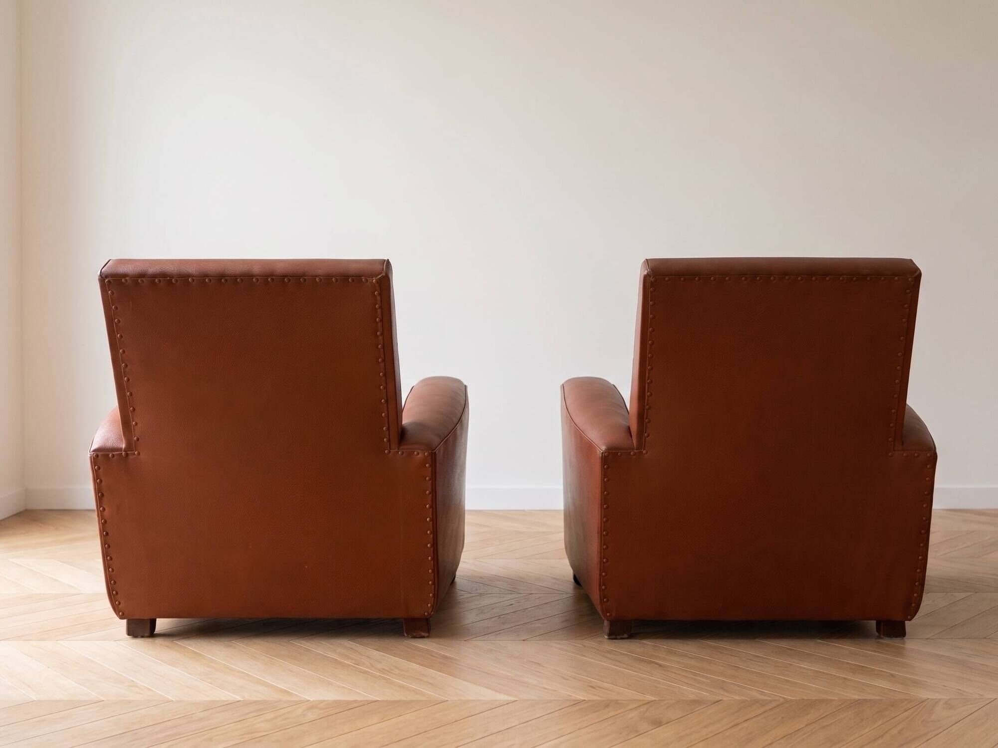 Pair of vintage brown leather club chairs