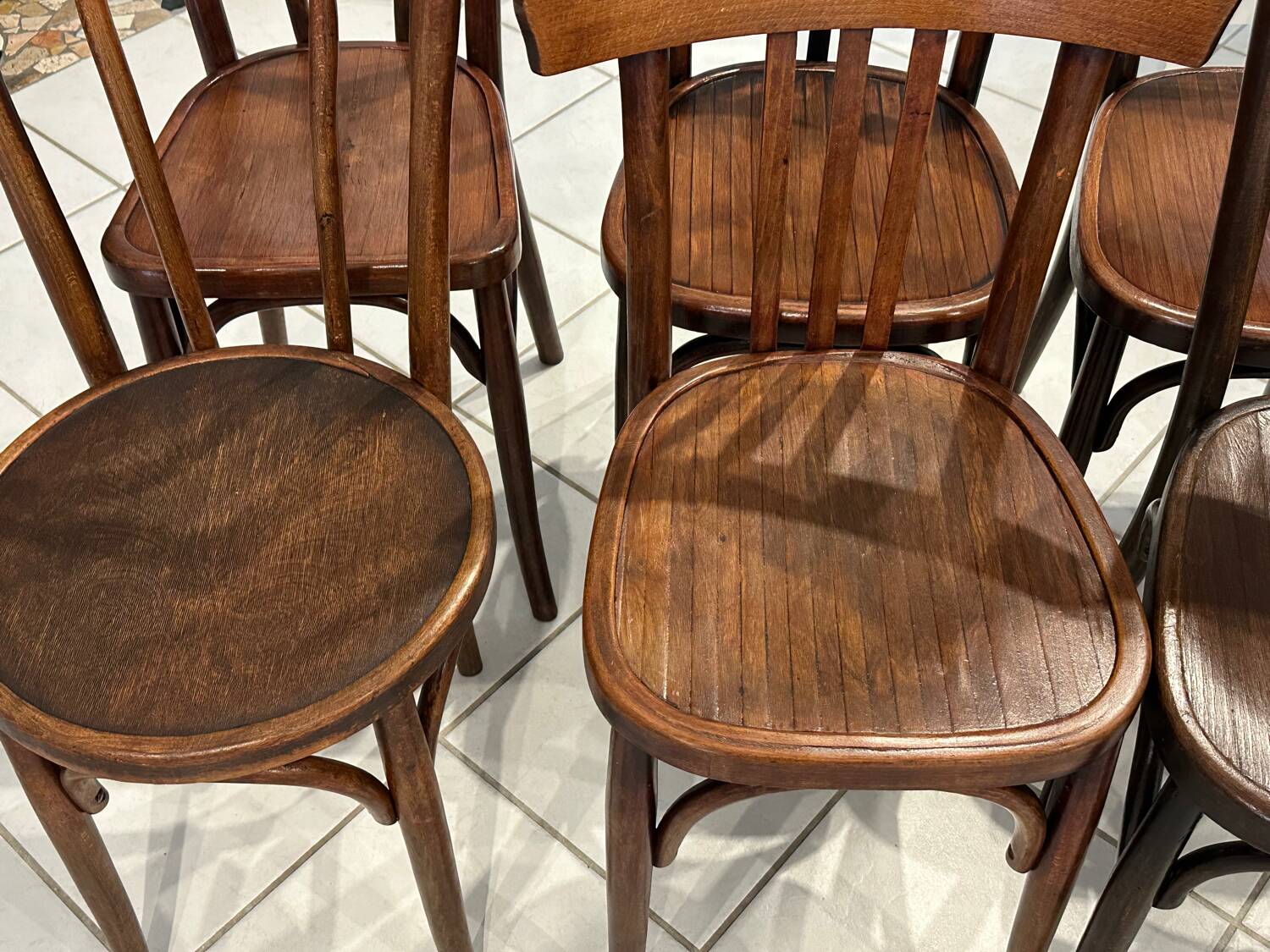 Set of 12 mismatched bistro chairs Baumann & Fischel 1930