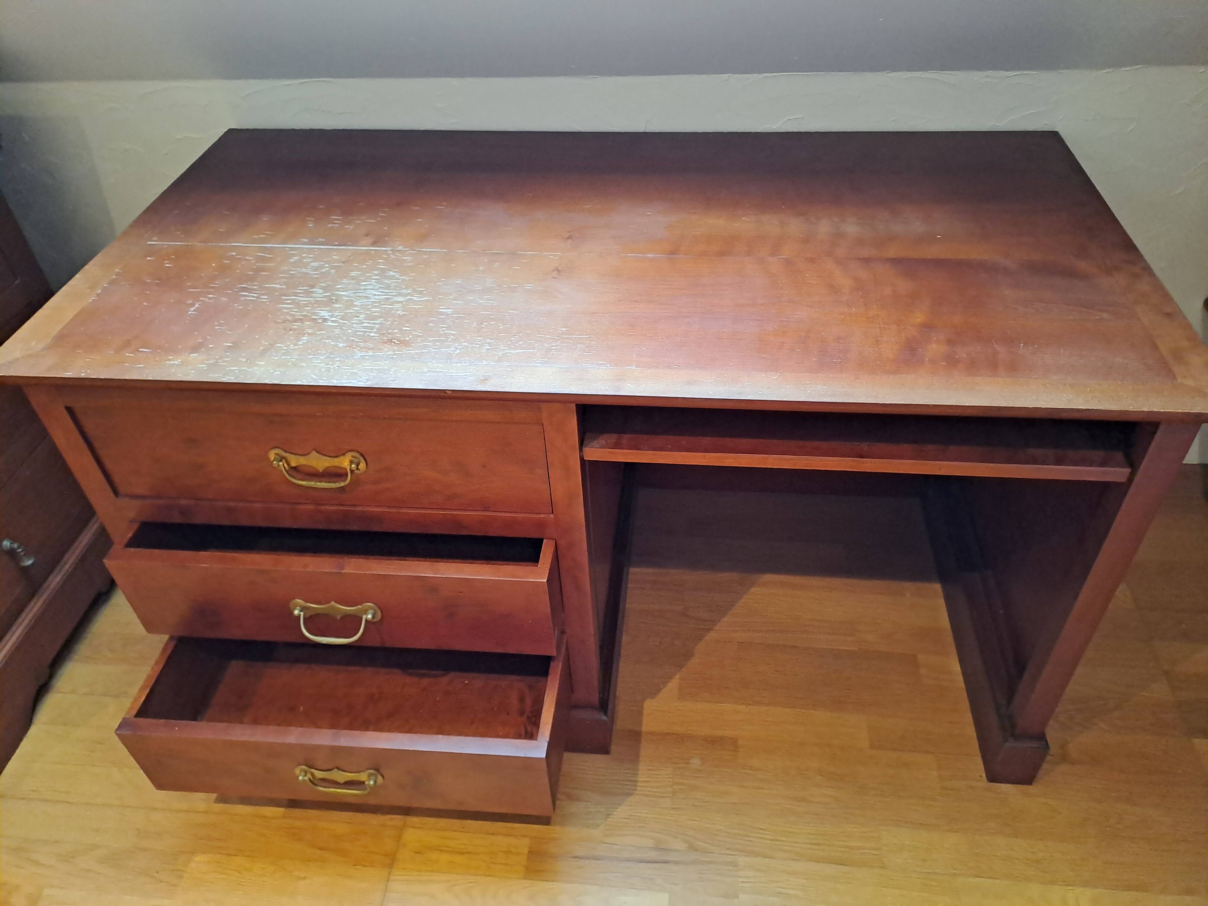 Solid cherry wood desk with 1 block and 3 drawers.