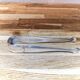 Antique sugar tongs in silvered metal