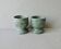 2 marble egg cups in veined white and green, circa 1980.