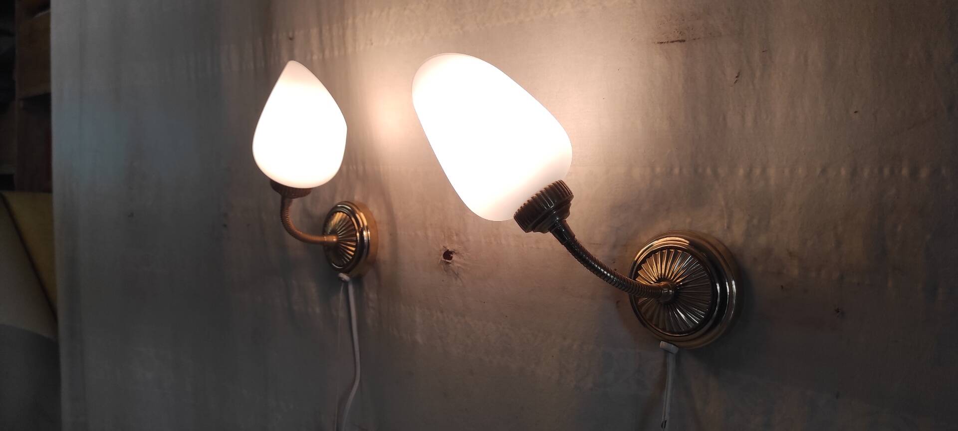 Articulated brass and opaline wall lights - mid 20th century.