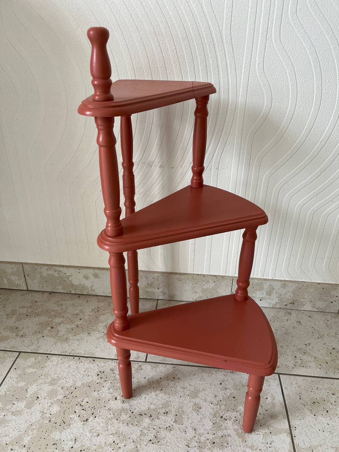 Old plant holder repainted in terracotta