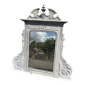 Miroir en bois sculpté patiné