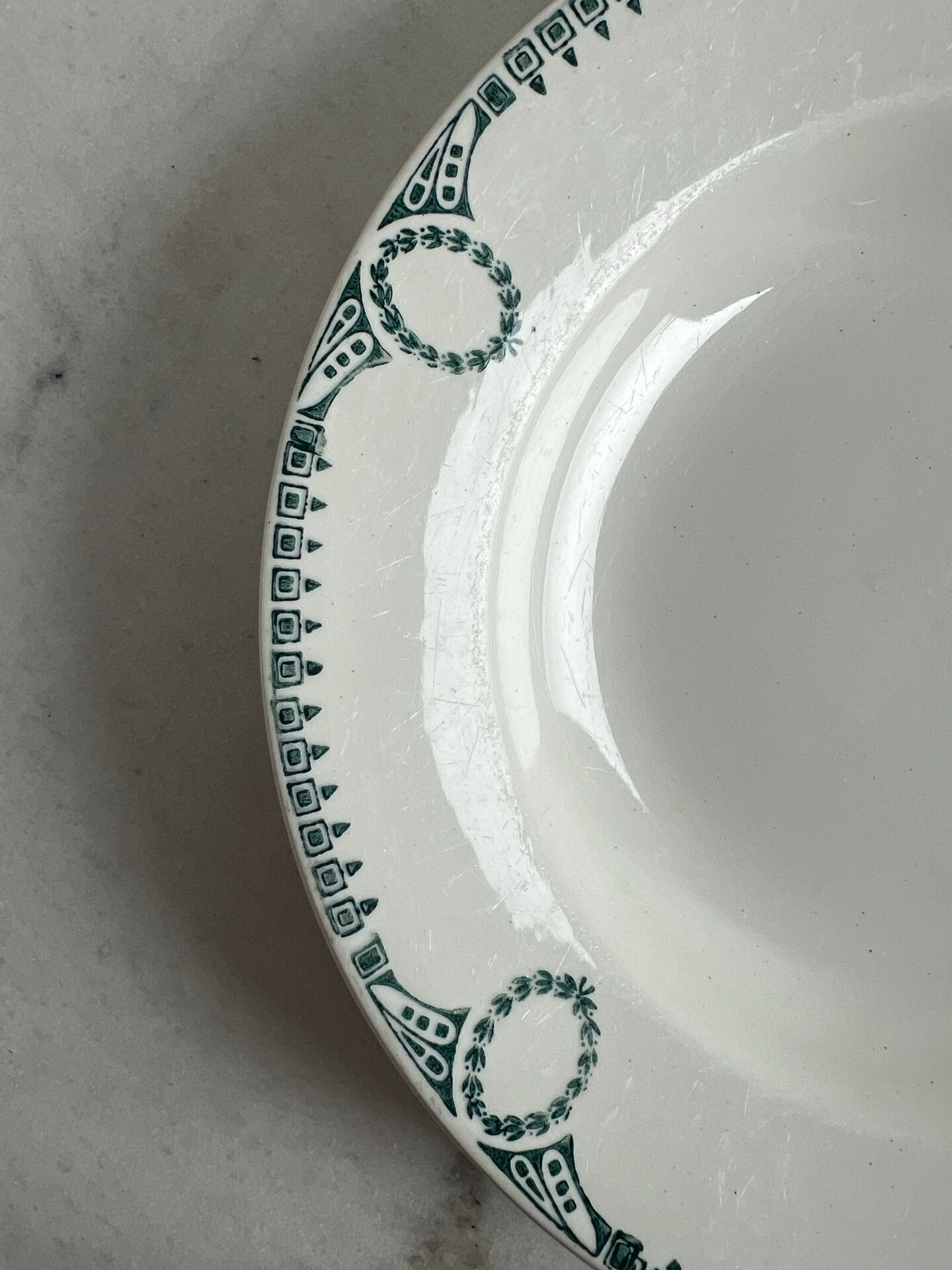 Céranord Saint Amand deep plate with green crown decoration.