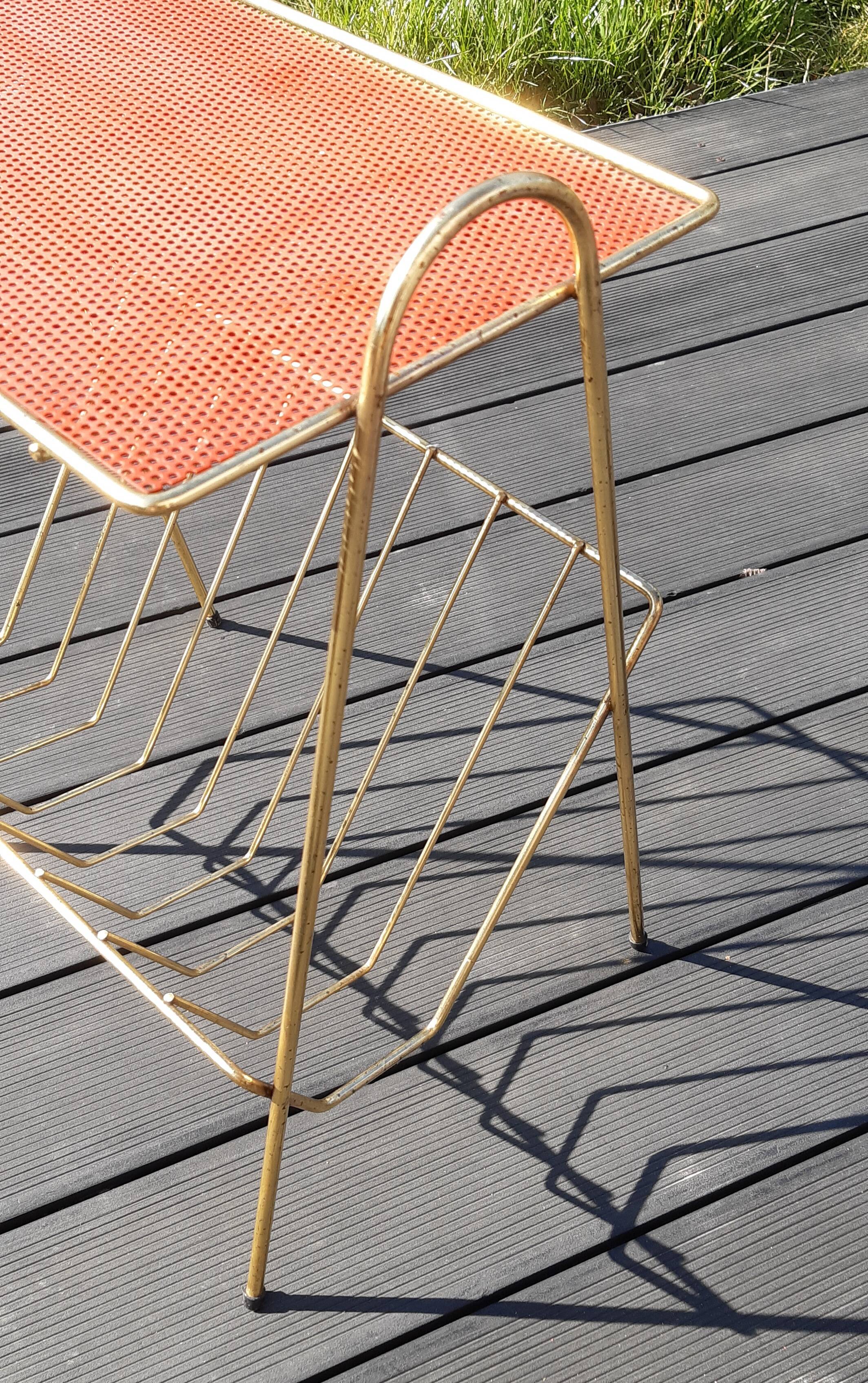 Perforated sheet metal magazine rack in the style of Mathieu Mategot, 1950s