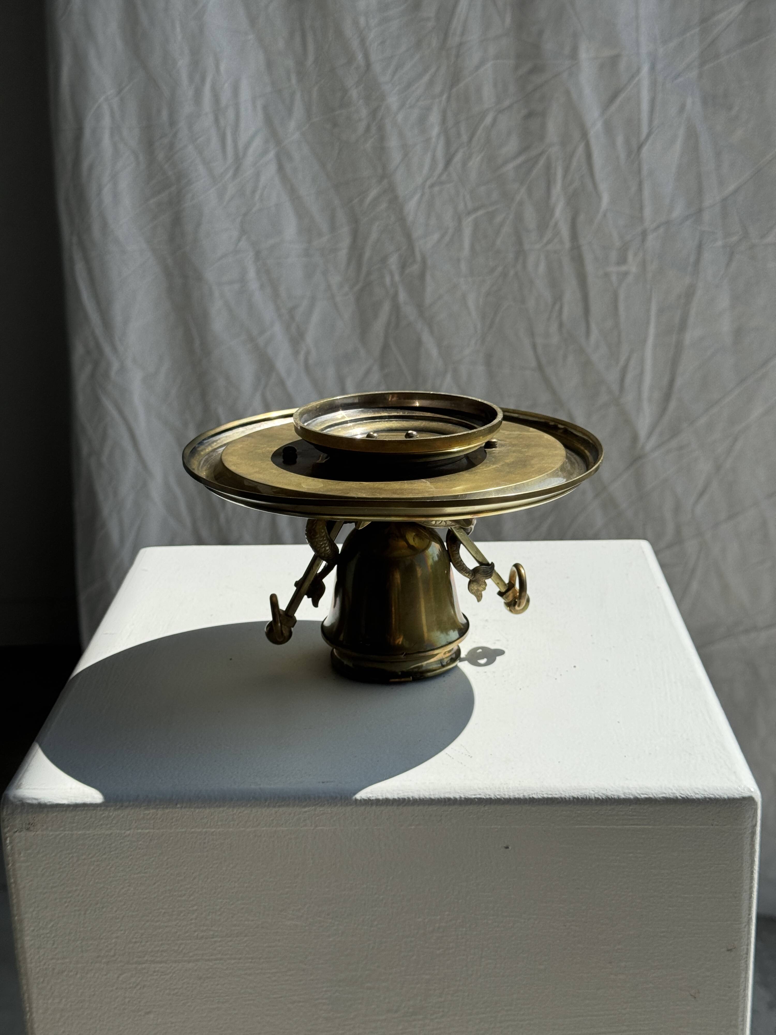 Large 19th century brass candlestick with dolphin motifs
