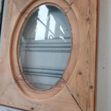 Old bullseye window with oval glass
