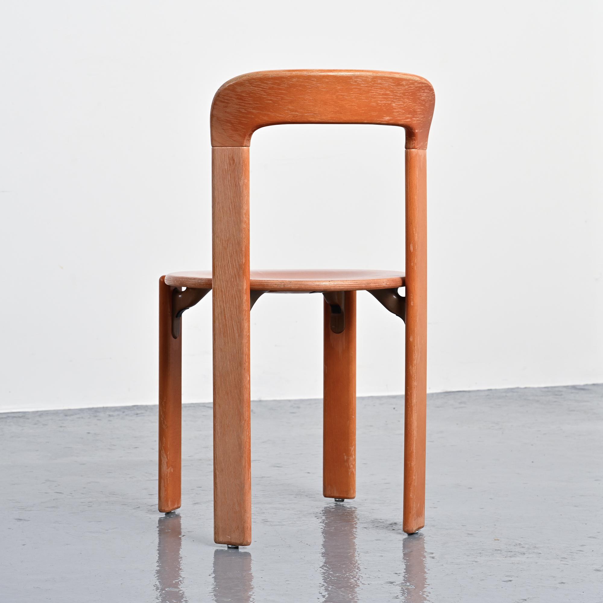 Rey chairs in stained red beech by Bruno Rey