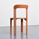 Rey chairs in stained red beech by Bruno Rey