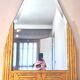 Antique Art Deco mercury mirror, in carved wood with gold leaf.