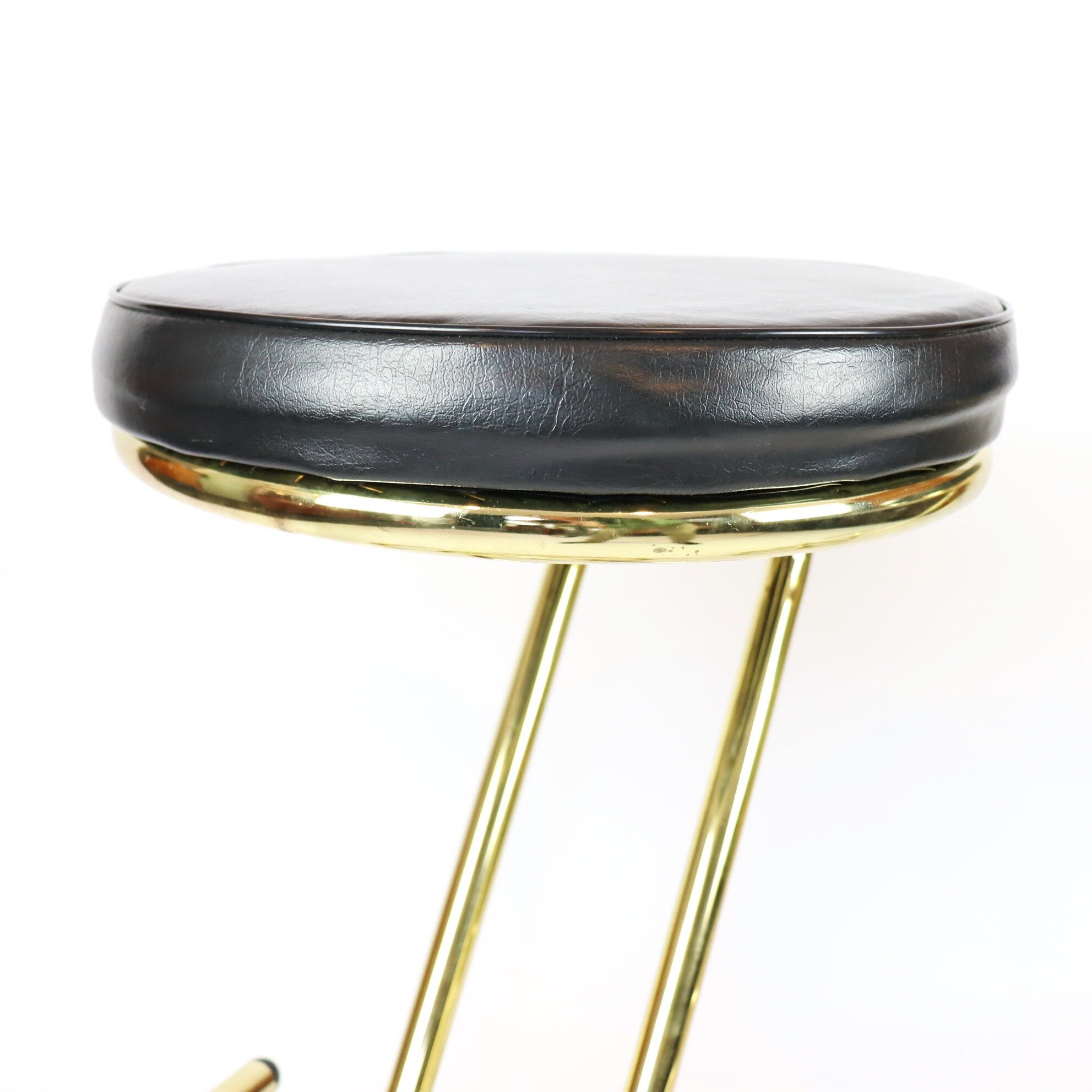 Pair of high brass stools