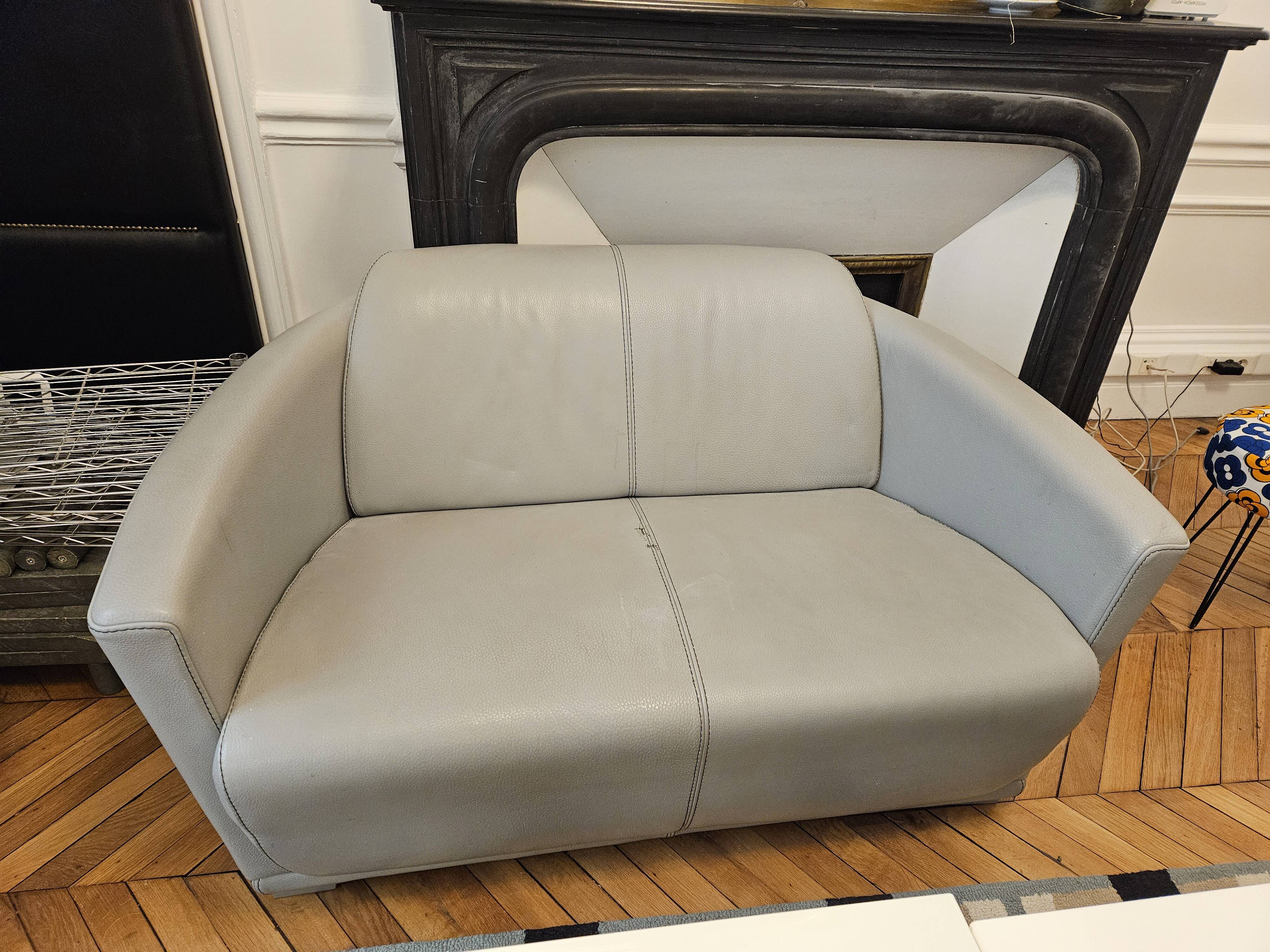 3-seater sofa, 2-seater sofa and an armchair in grey leather by Calia Italia.