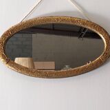 Art Deco oval mirror in gilded wood, France circa 1920