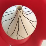 Designer vase in white ceramic with enamelled black stripes.