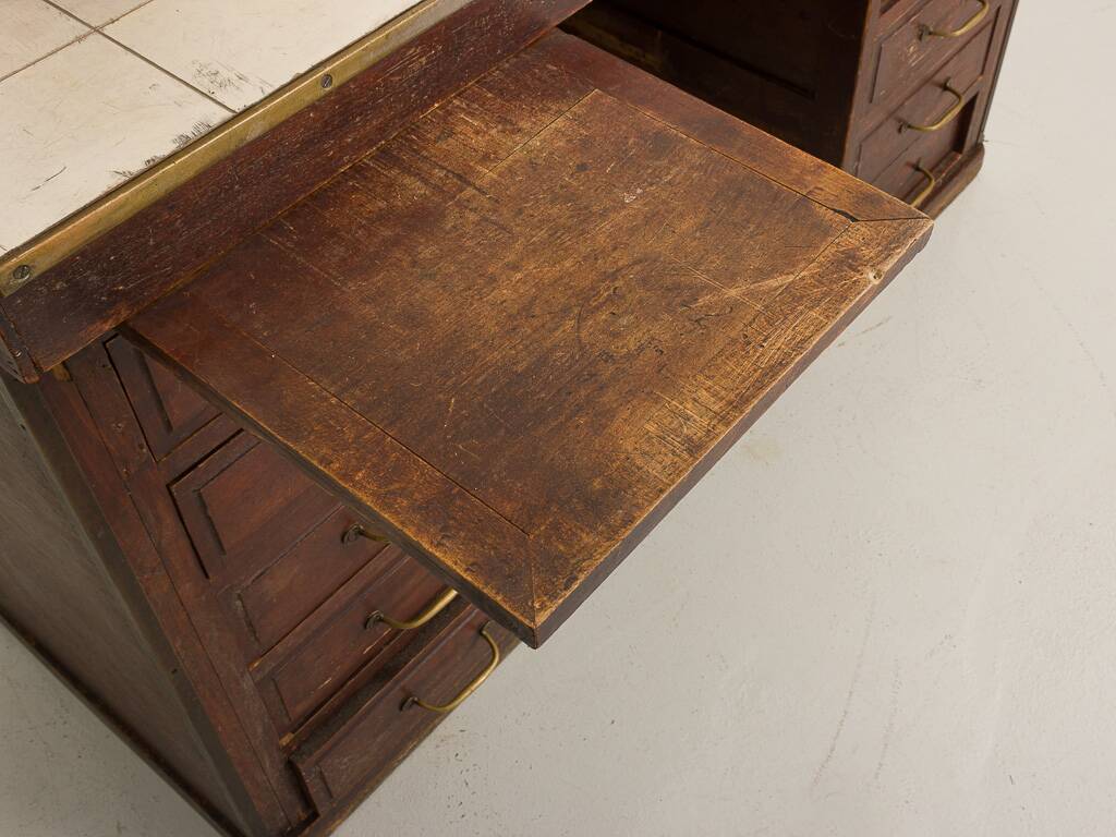 Small vintage stained wooden countertop with 2 shelves and 10 drawers
