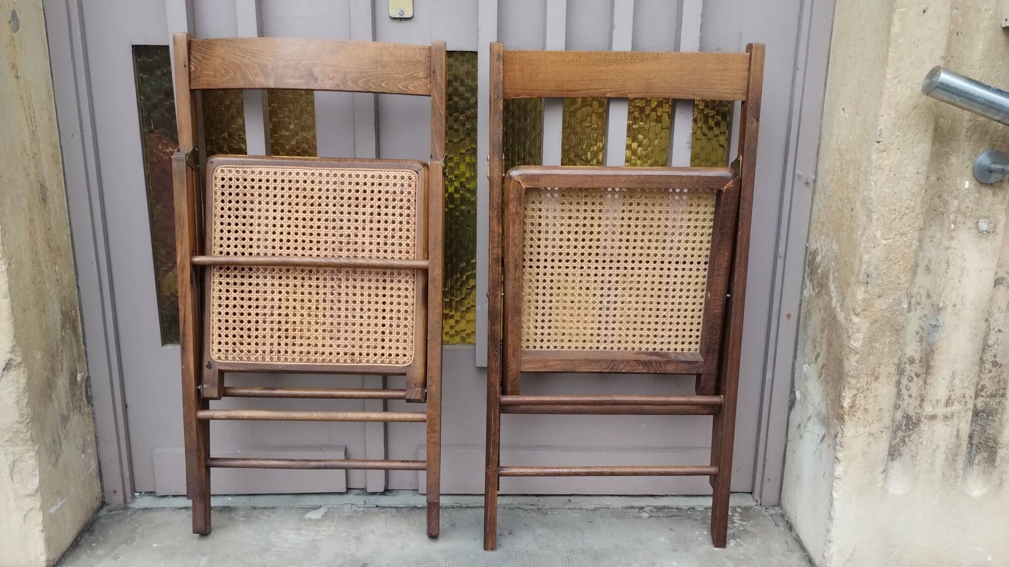 Pair of vintage wooden and cane folding chairs