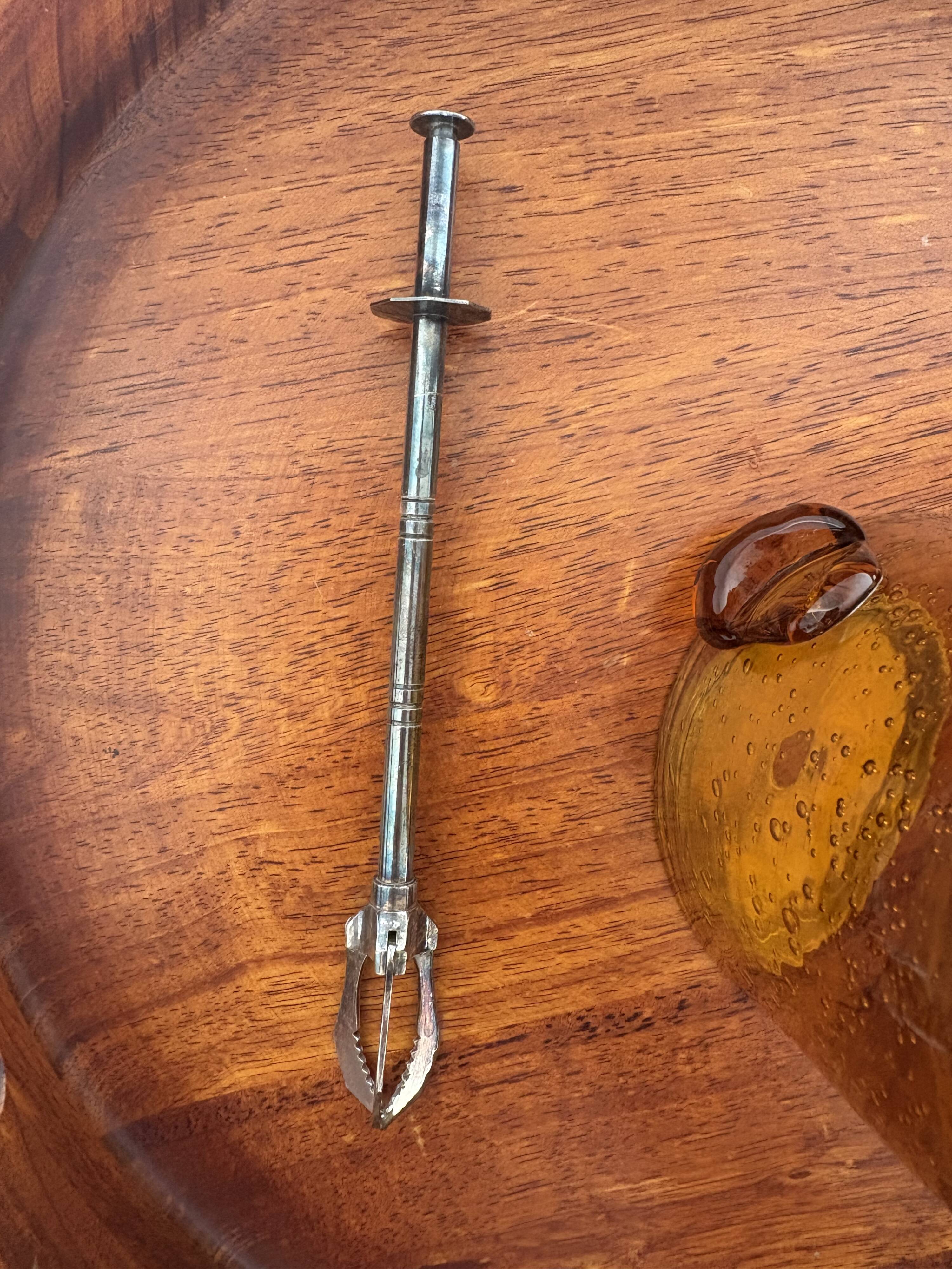 Amber bubble glass ice bucket signed Biot, with its tongs.