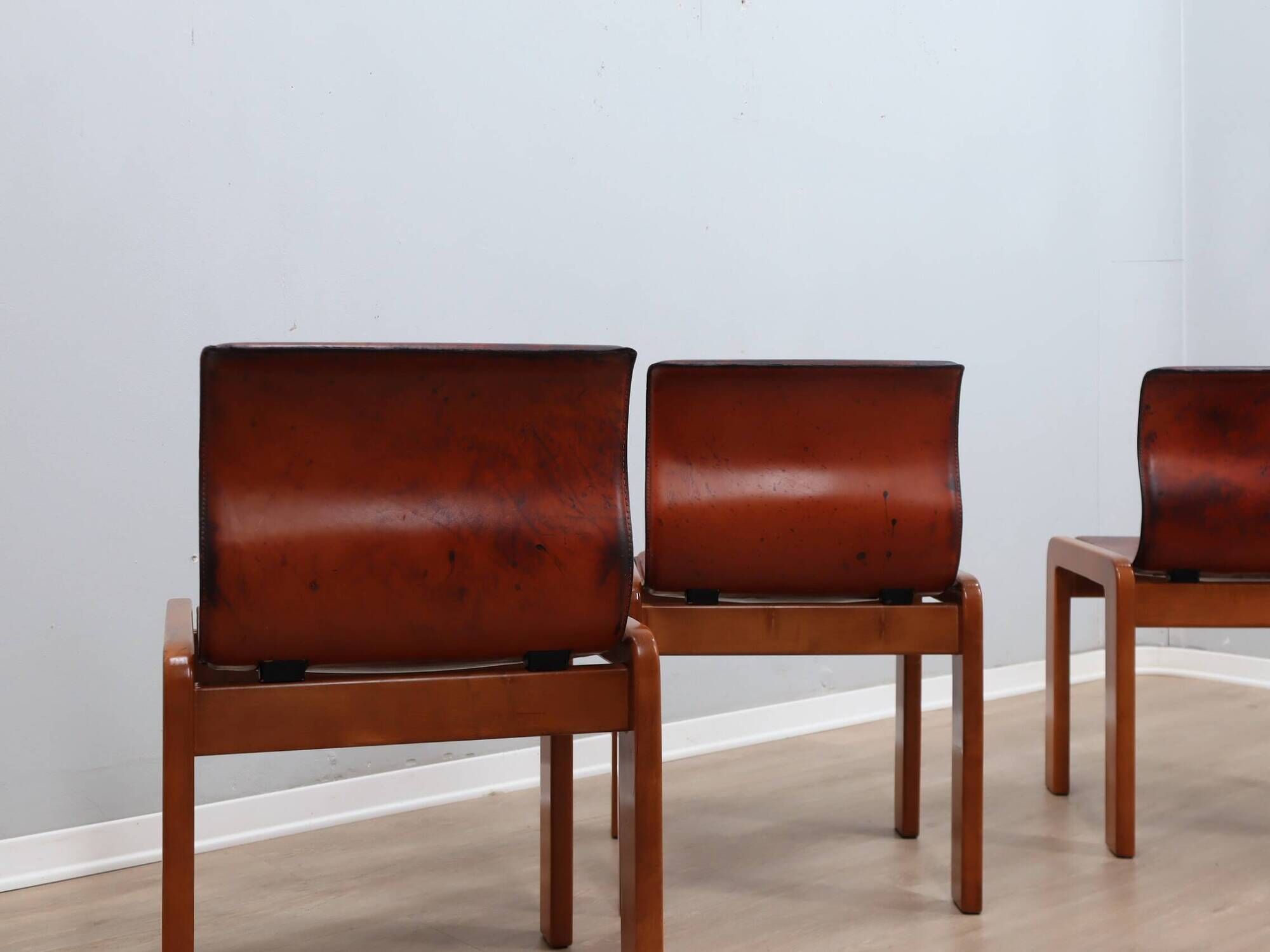 Curved wooden and leather chairs by Afra and Tobia Scarpa from the 1970s, set of 4.