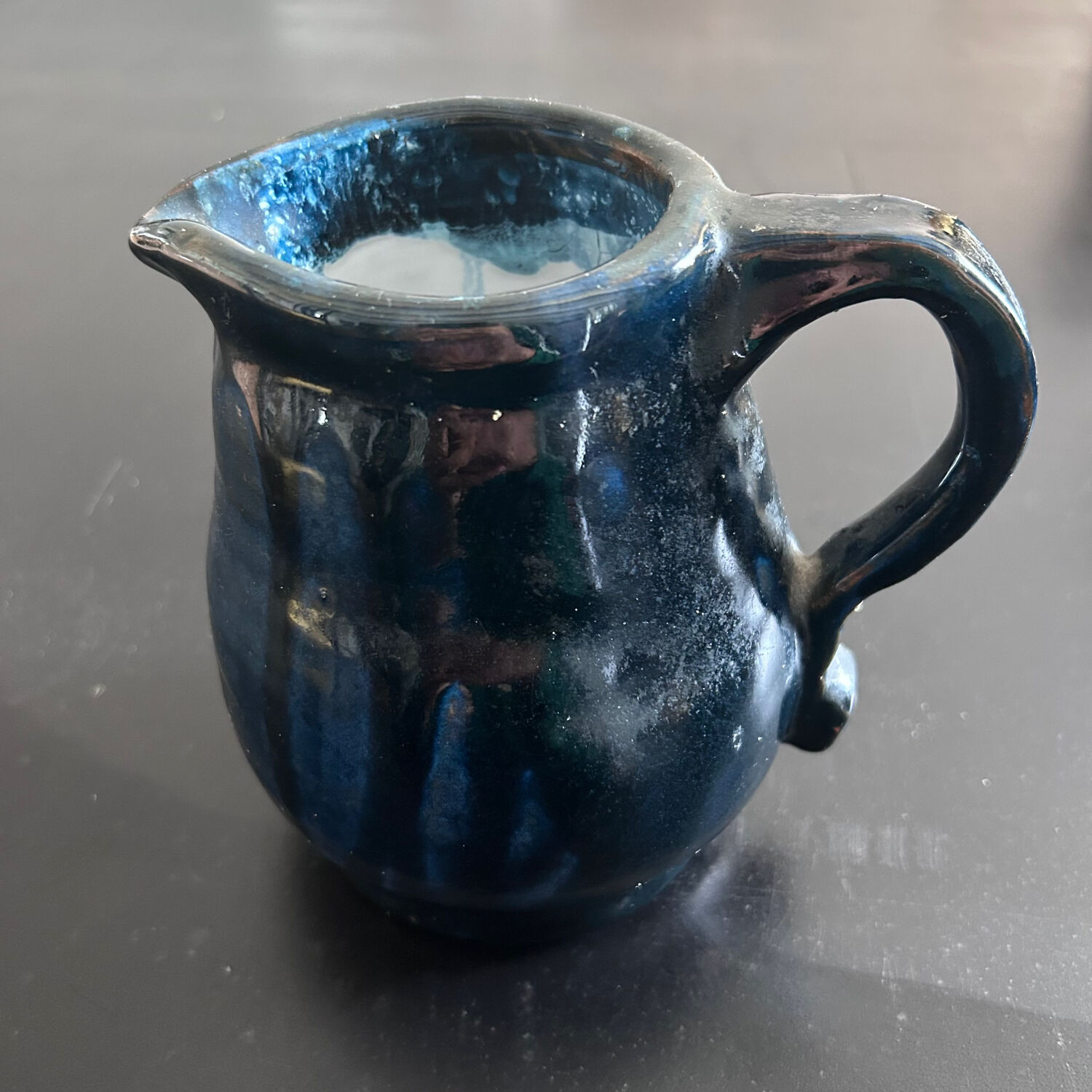 Handcrafted midnight blue pitcher signed