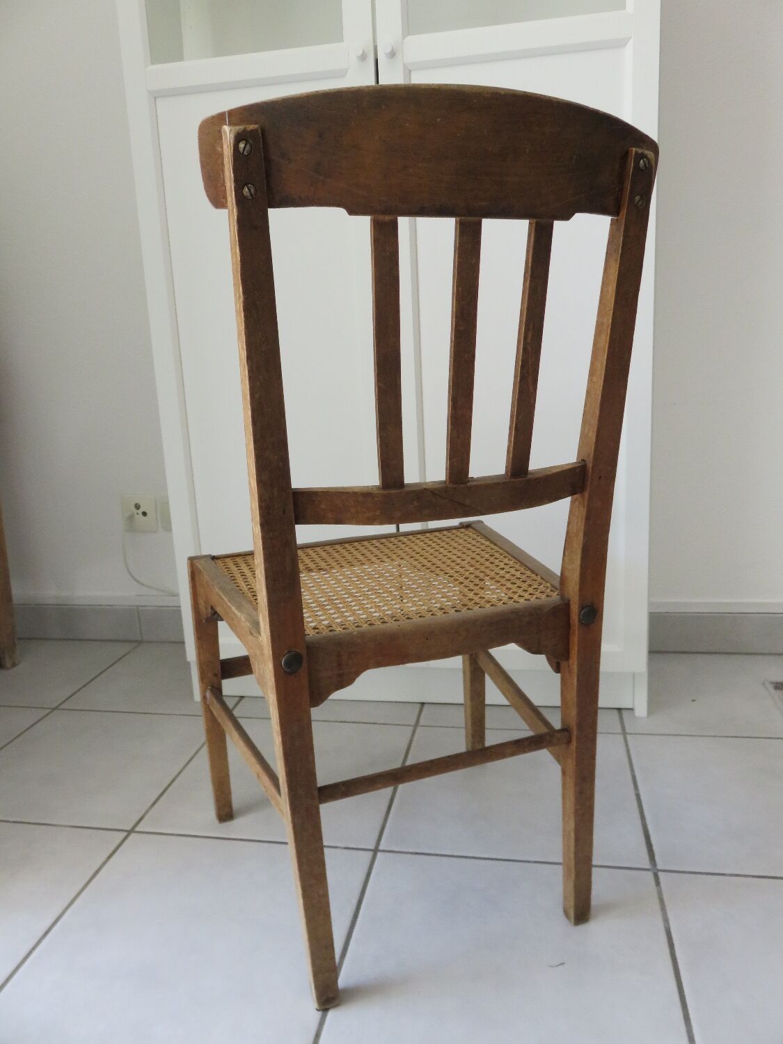 Antique solid wood chair with caning, country house style.