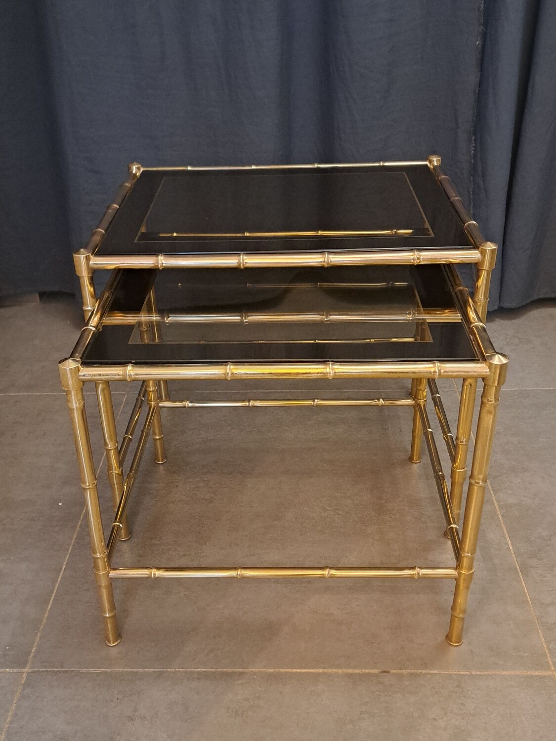 Nesting bamboo tables with gold-plated brass trim