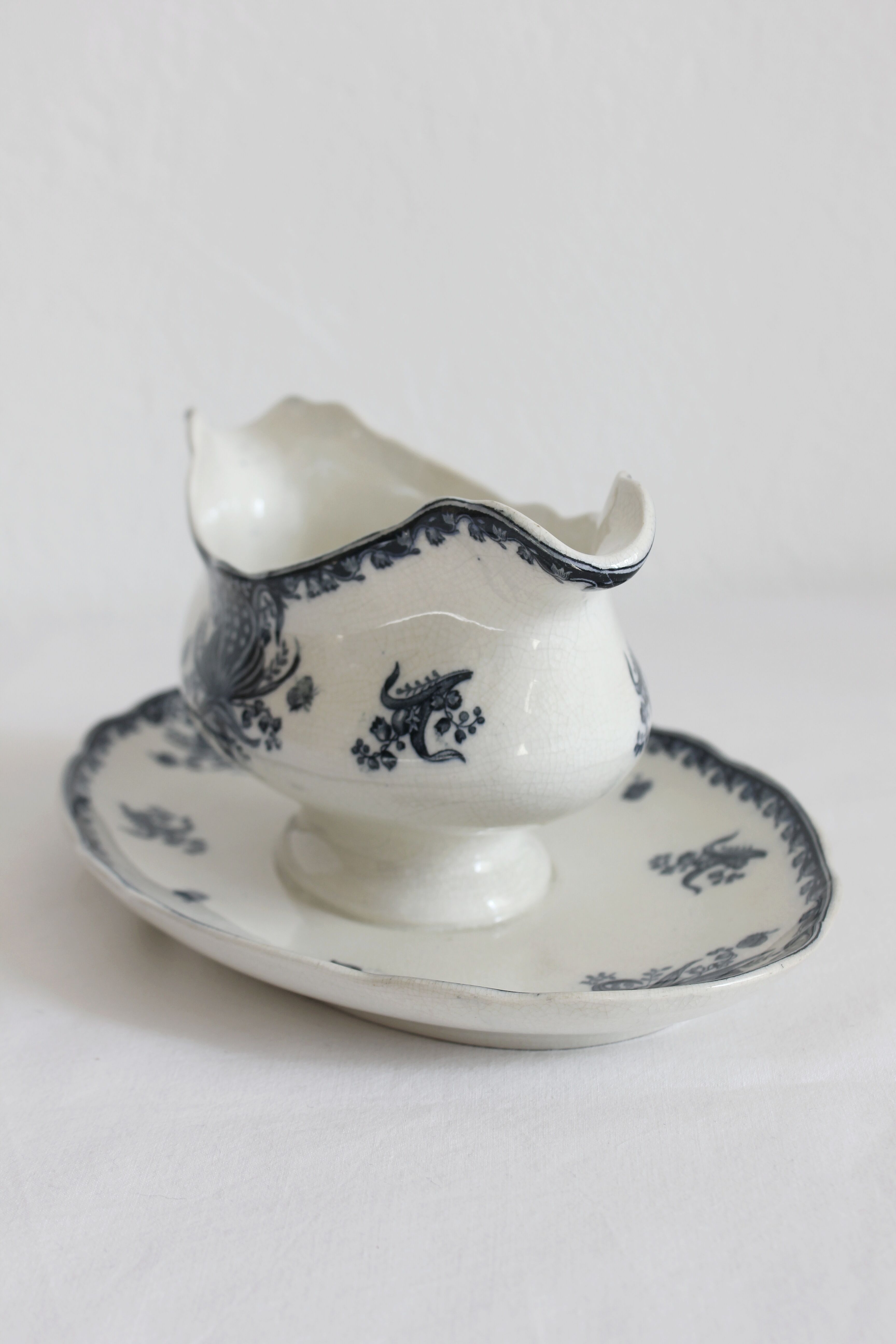 Ironware sauce boat with blue palmette decoration