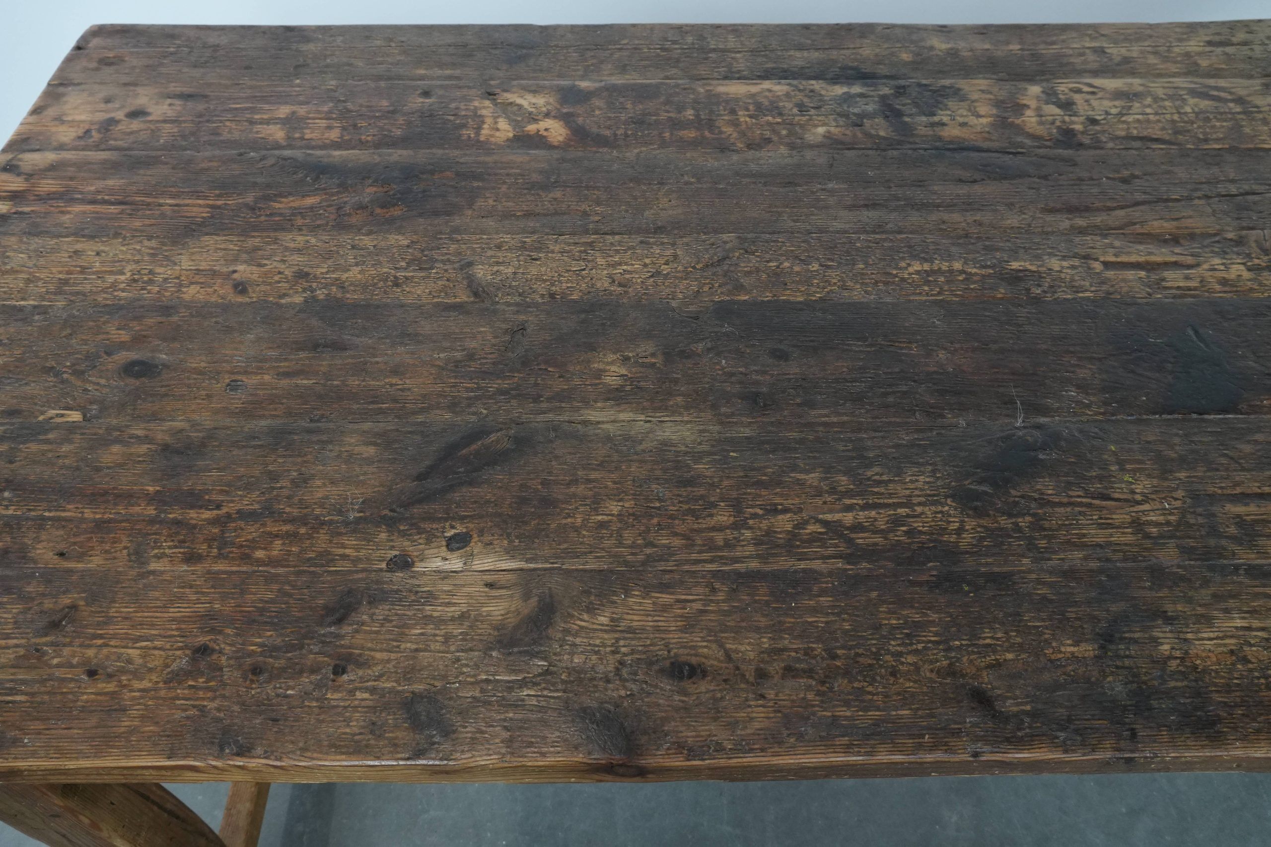 Magnificent and robust antique farmhouse dining table made of pine wood