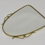 Elegant wall mirror in brass and black from the mid-century, Italy, 1950s.