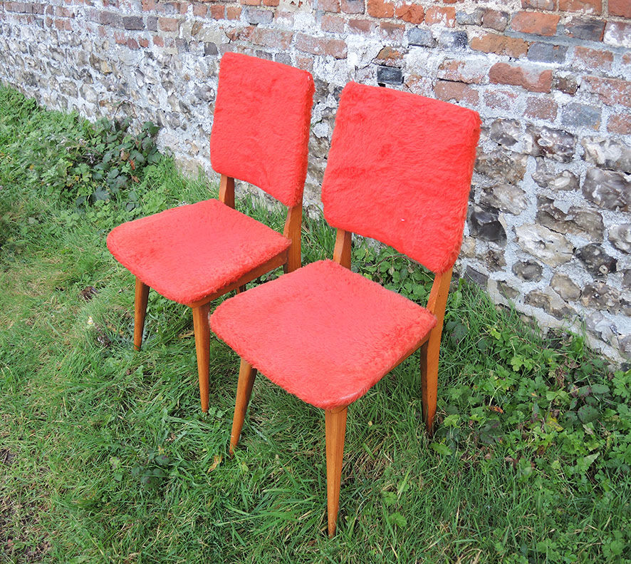 2 old red 'moumoute' chairs