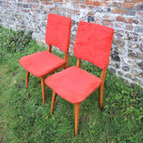 2 old red 'moumoute' chairs