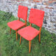 2 old red 'moumoute' chairs