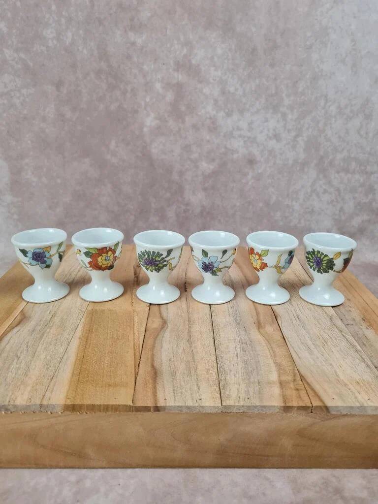 Set of 6 antique egg cups in porcelain from Paris + wooden stand