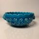 Turquoise cup woven by Émile Tessier in Malicorne.