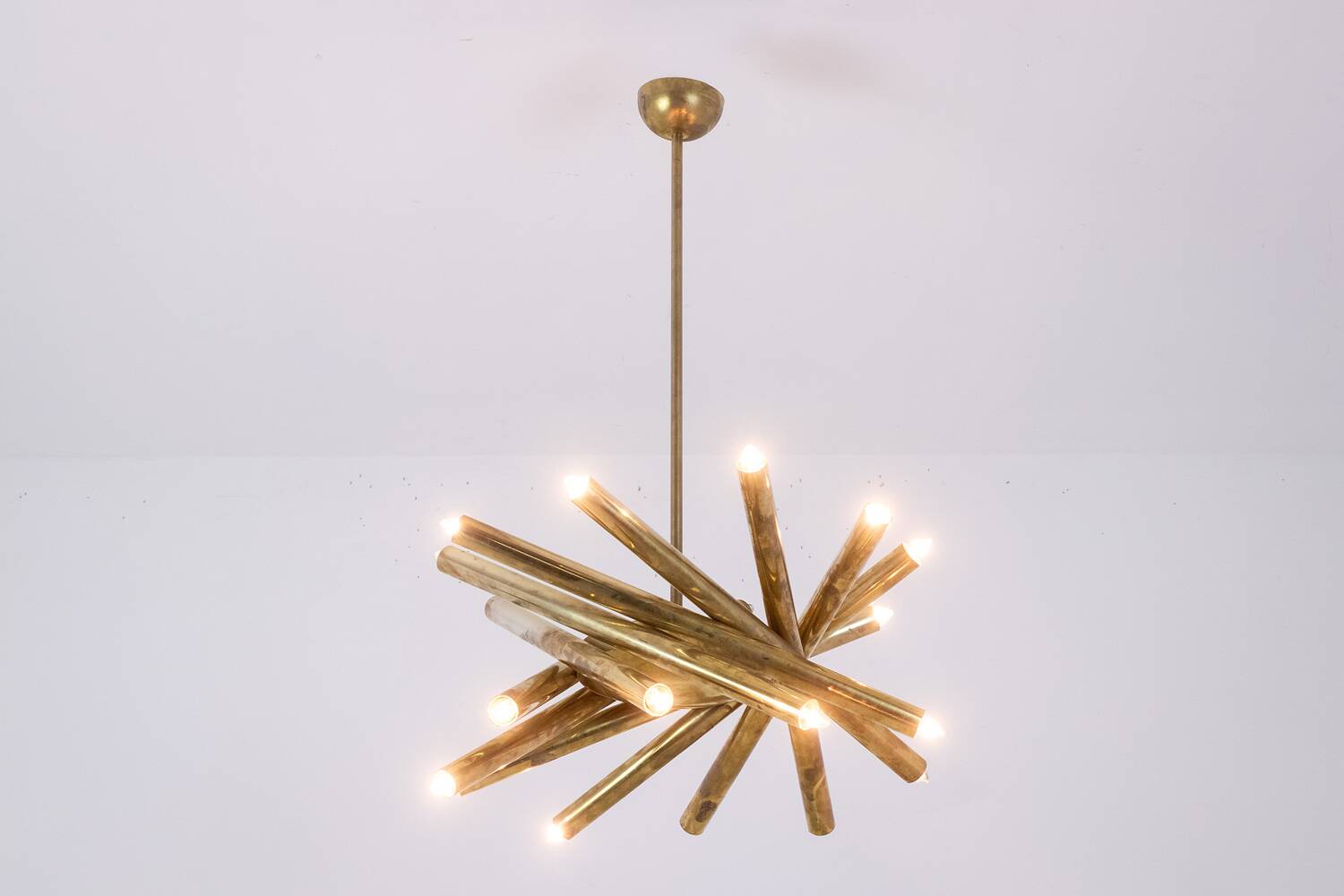 Pair of matte gold-plated brass chandeliers. Italian work from the 1970s.
