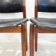 Set of four Arne Vodder chairs in hardwood and black leather.