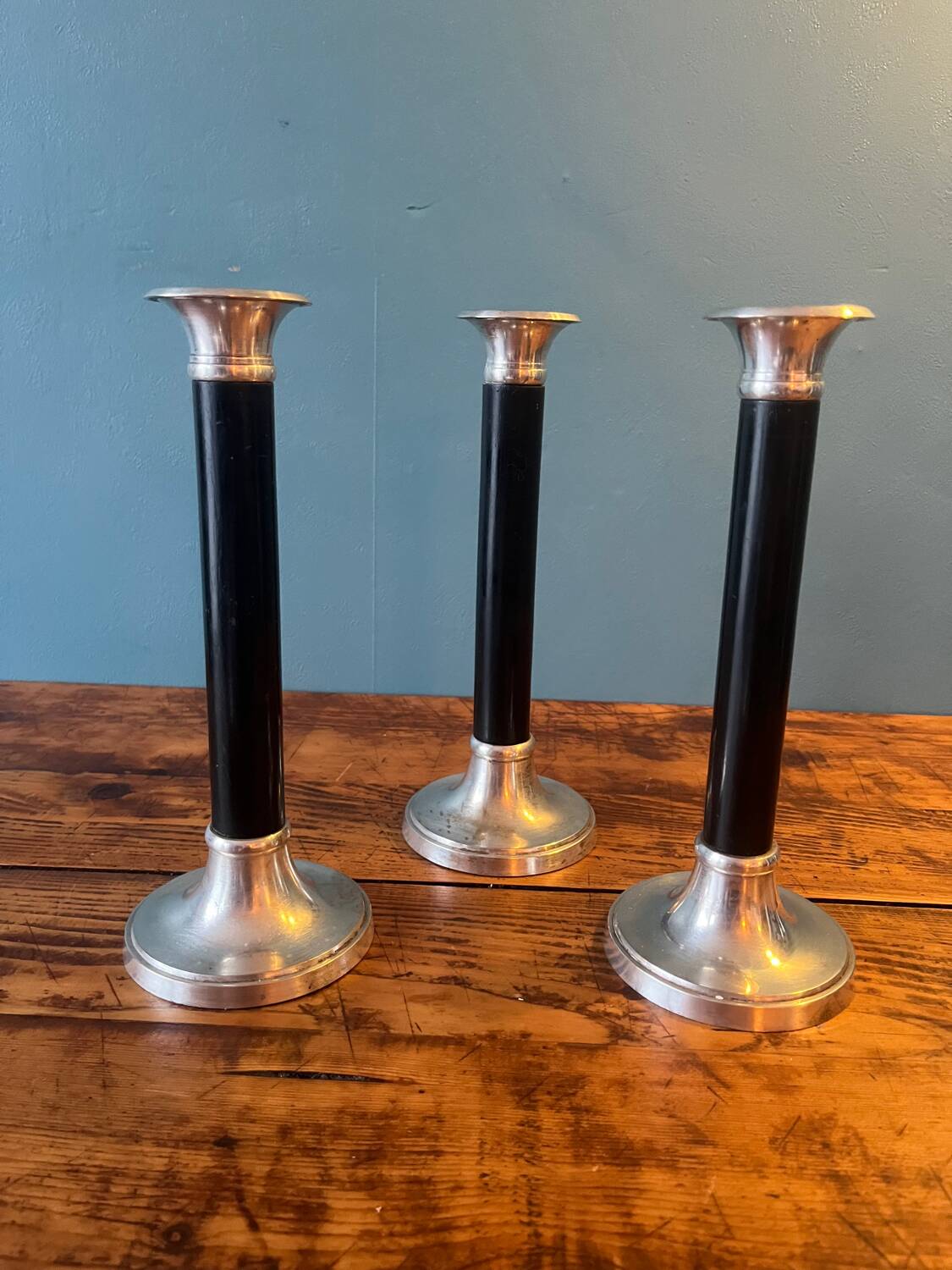 Trio of metal and wood candlesticks from the 80s