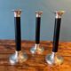Trio of metal and wood candlesticks from the 80s