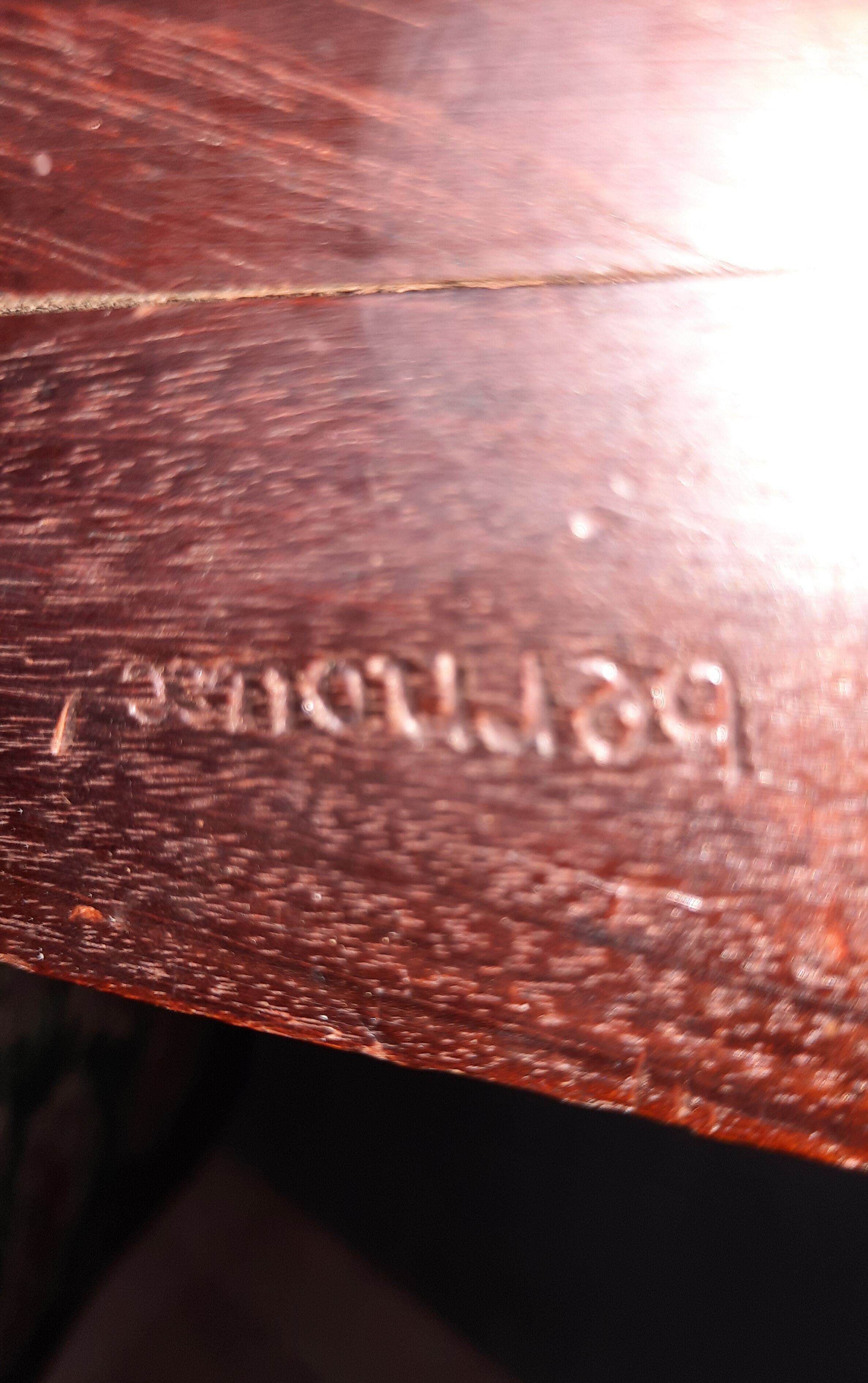 Stamped voltaire armchair