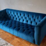 Royal blue velvet upholstered sofa