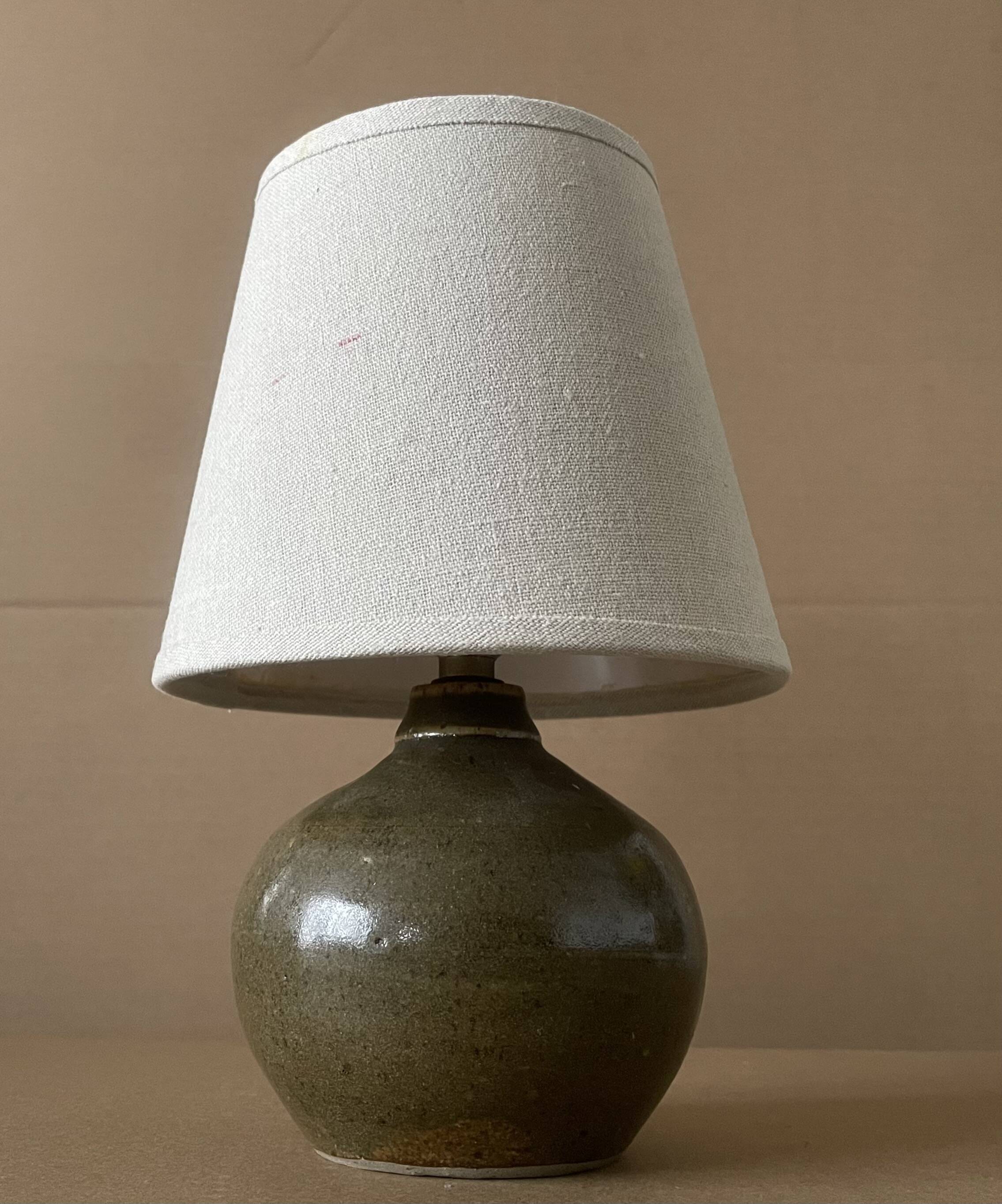 Small old enamelled sandstone lamp