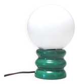 Green 1970s floor lamp with a globe shade.