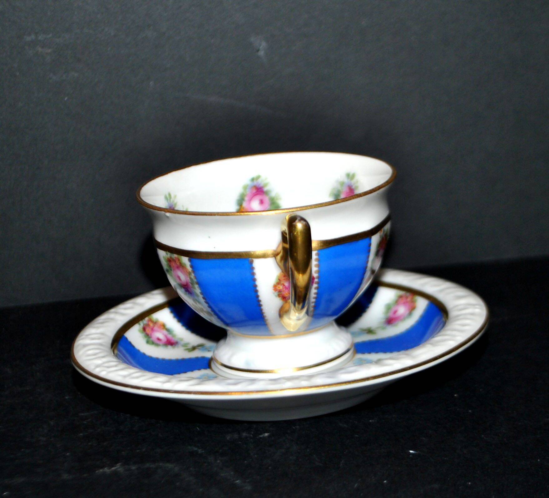 Maria collector's cup in blue and gold German porcelain.